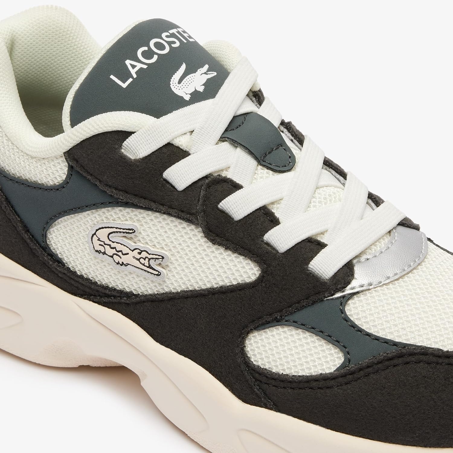 image:imageLacoste Juniors Storm 96 Vintage SneakersDark BaobabDark BaobabMother of Pearl